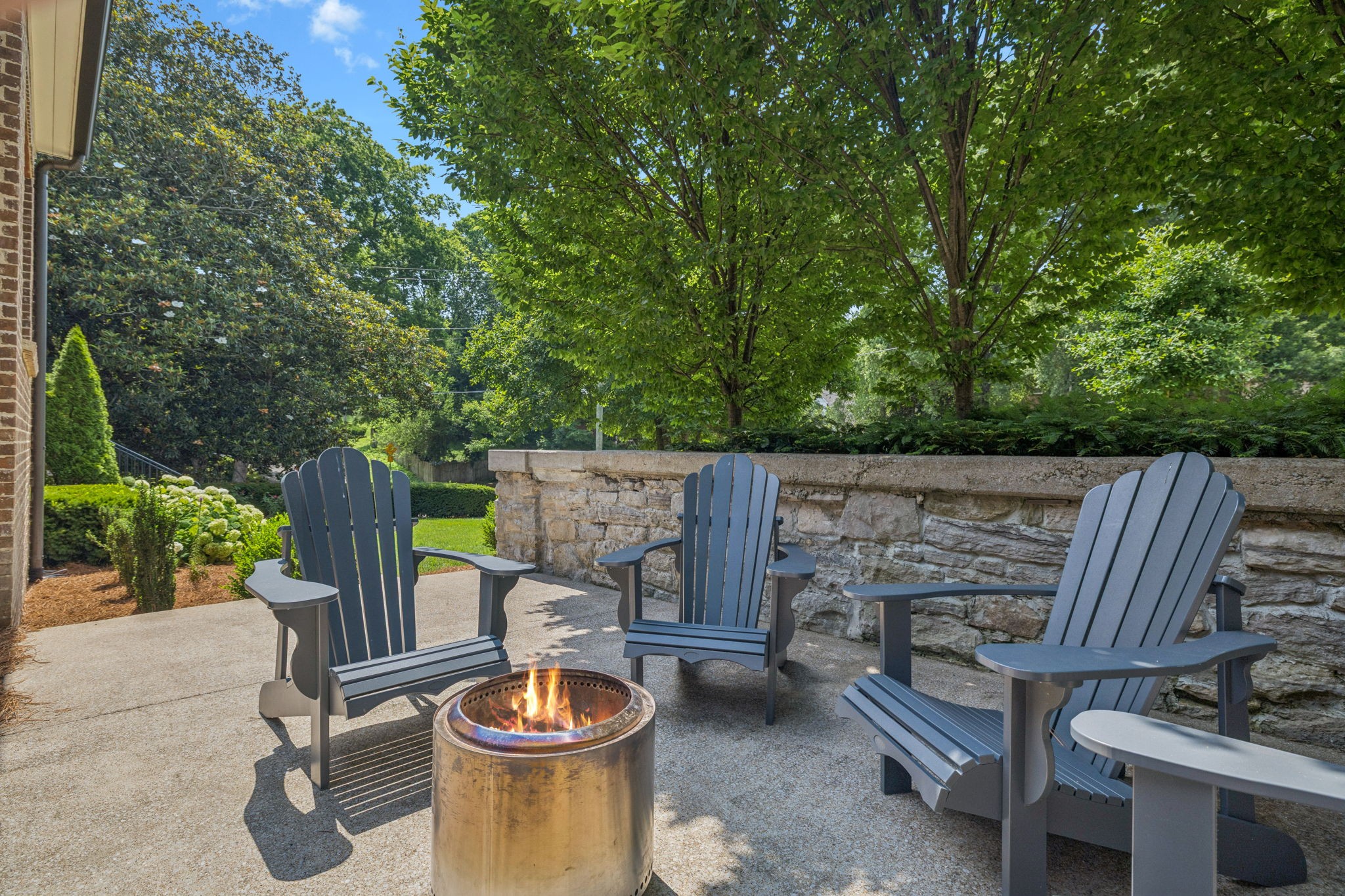 2401 Sterling Road Nashville, TN 37215 - Photo 10 of 92 a backyard of a house with fire pit and outdoor seating