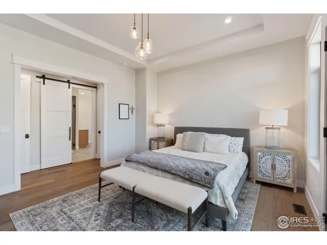 a living room with a bed furniture and a window