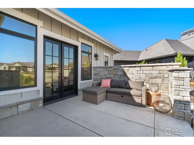a view of a patio with couches and potted plants