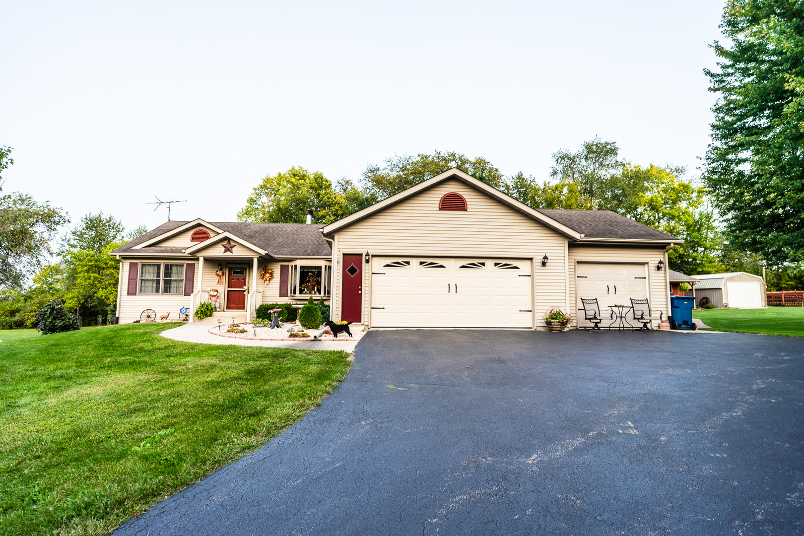 2018 Grand Detour Road Dixon, IL 61021 - Photo 2 of 25 a view of a house with a yard and garage