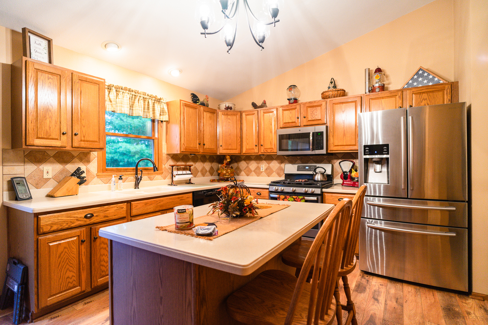 2018 Grand Detour Road Dixon, IL 61021 - Photo 4 of 25 a kitchen with stainless steel appliances a stove a sink dishwasher and a refrigerator