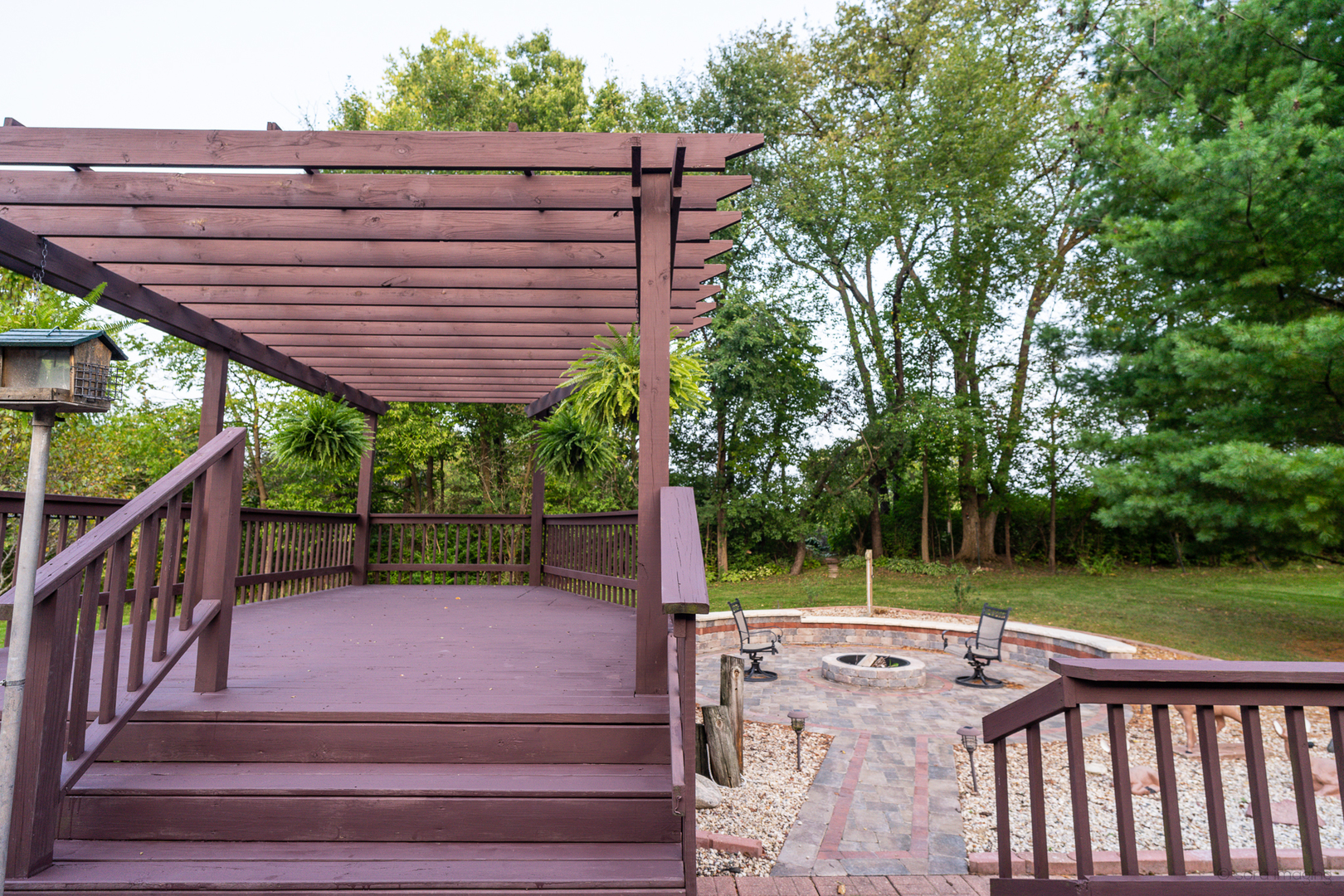 2018 Grand Detour Road Dixon, IL 61021 - Photo 10 of 25 a view of a wooden deck with chairs and a yard