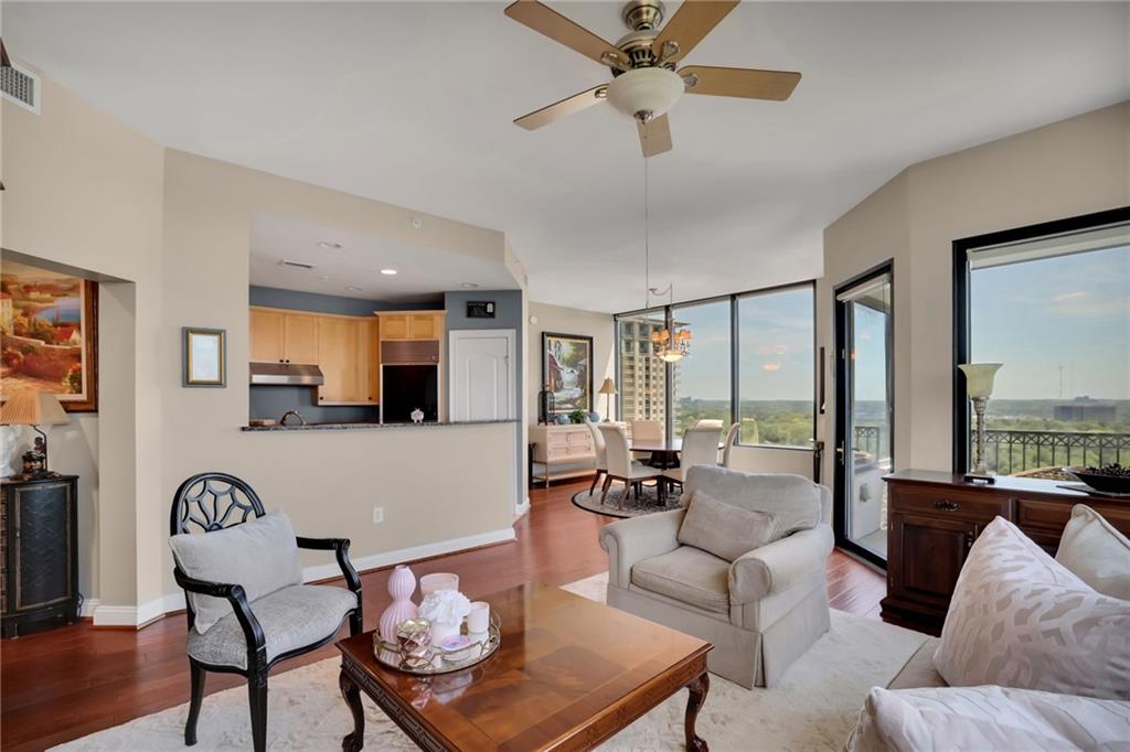 2828 Peachtree Road Northwest, Unit 1901 Atlanta, GA 30305 - Photo 6 of 35 a living room with furniture and a large window