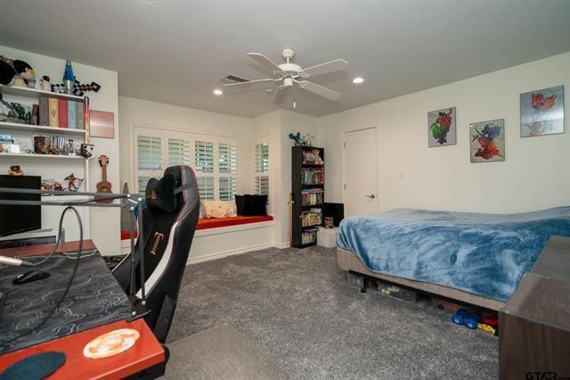 431 Gifford Street Rusk, TX 75785 - Photo 27 of 40 a bedroom with furniture and a flat screen tv