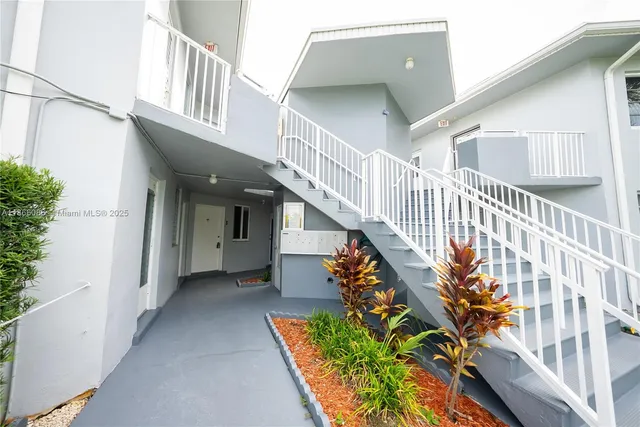 an entryway with a flower pot