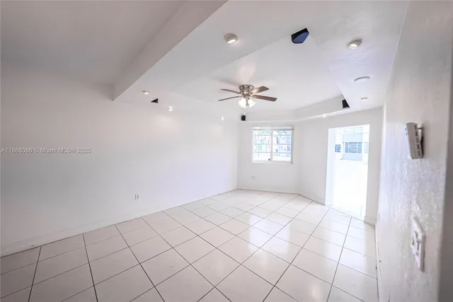 a view of an empty room and window