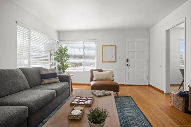 a living room with furniture and a rug