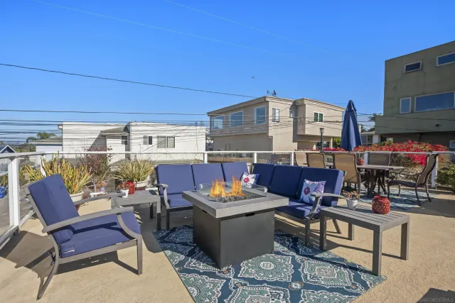 a outdoor living space with furniture and a potted plant