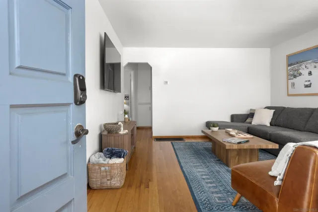 a living room with furniture and a rug