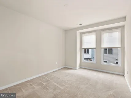 a view of hallway with wooden floor