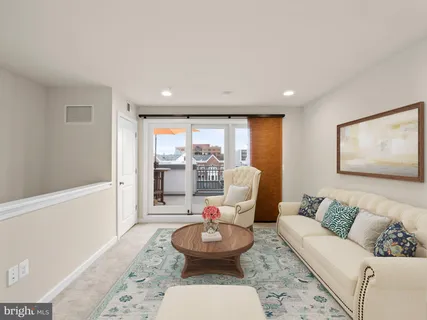 a living room with furniture and window