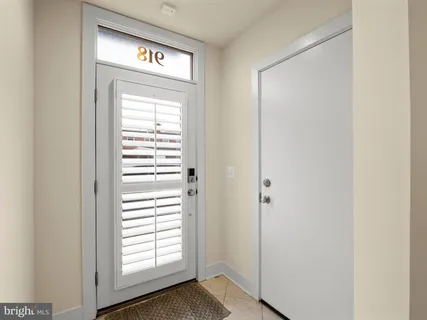 a view of front door with wooden floor