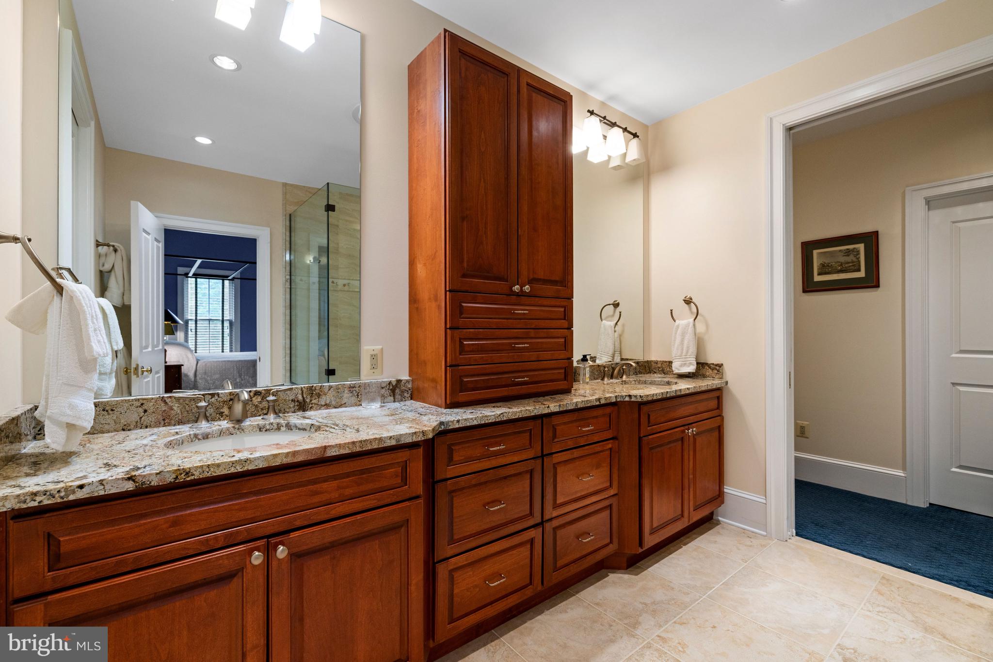 20147 Woodtrail Road Round Hill, VA 20141 - Photo 27 of 41 a bathroom with a granite countertop double vanity sink and mirror