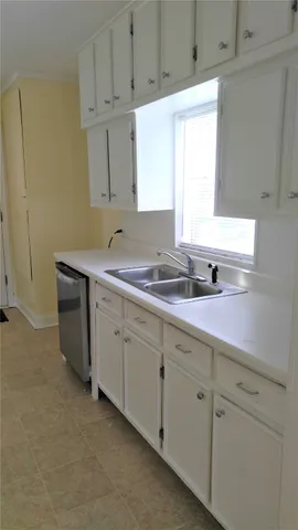 a room with gym equipment and a window