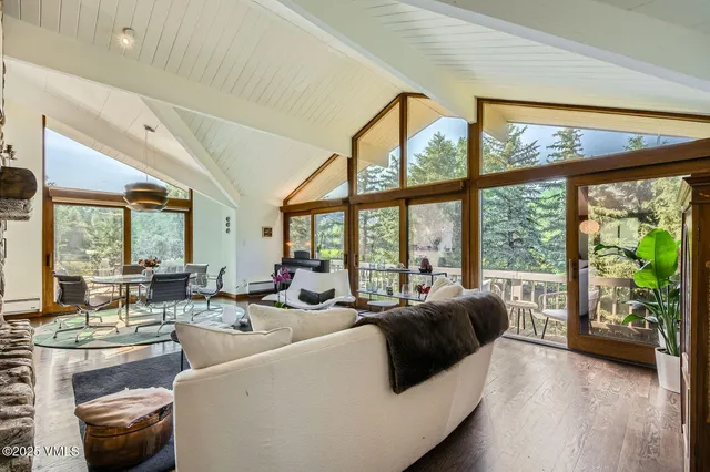 a bedroom with furniture and a flat screen tv