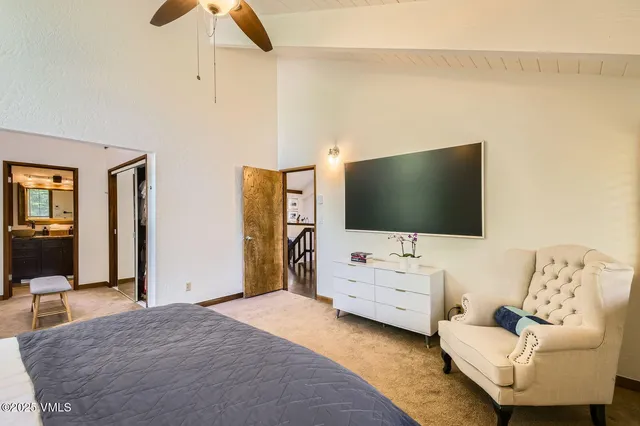 a bathroom with a granite countertop shower mirror and a sink