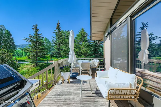 a kitchen with stainless steel appliances a stove a sink and a refrigerator