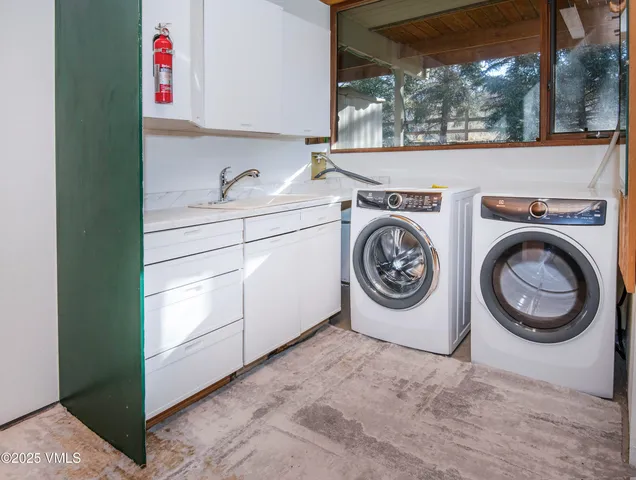 a view of a chairs and table in the balcony