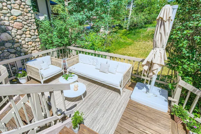 a view of a house with a yard porch and sitting area