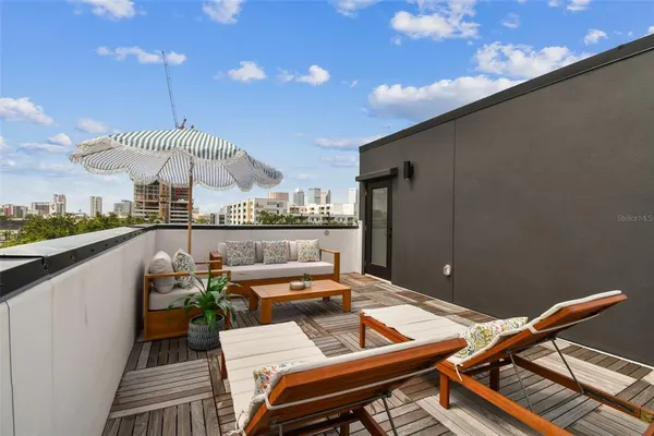 a outdoor dining space with furniture