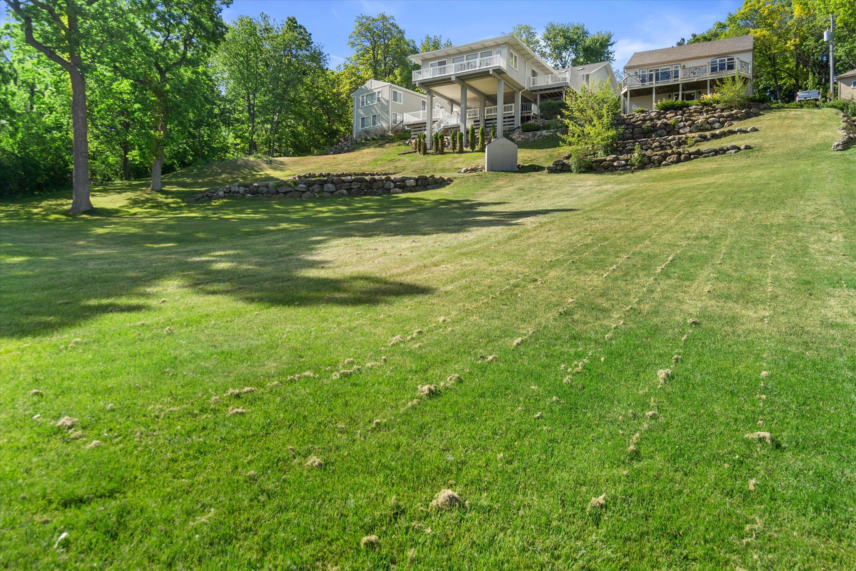 N39W27485 Hillside Grove Road Pewaukee, WI 53072 - Photo 28 of 43 Back yard to lake