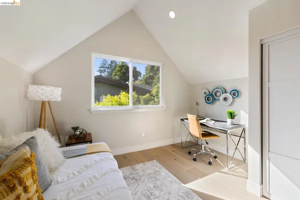 a bedroom with a bed and furniture