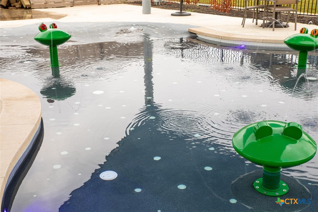 6313 McMurtry Street Austin, TX 78747 - Photo 4 of 12 a view of a backyard of a house with table and chairs
