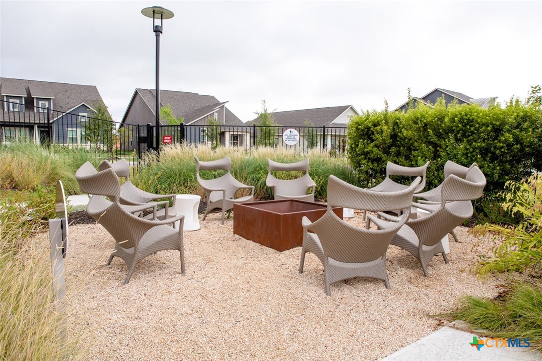6313 McMurtry Street Austin, TX 78747 - Photo 7 of 12 a view of a patio with a chairs and table in the patio