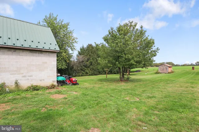 a view of swimming pool with a yard