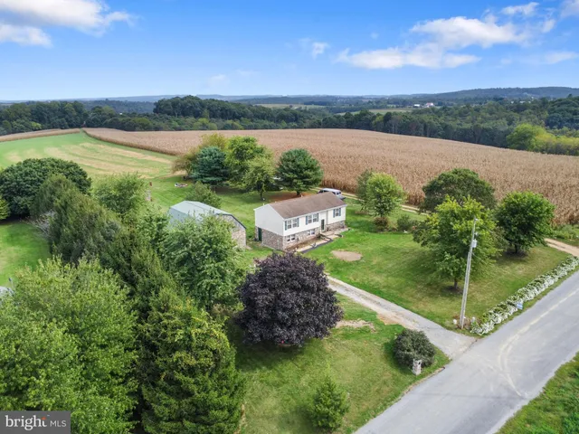 a view of a lake with a yard
