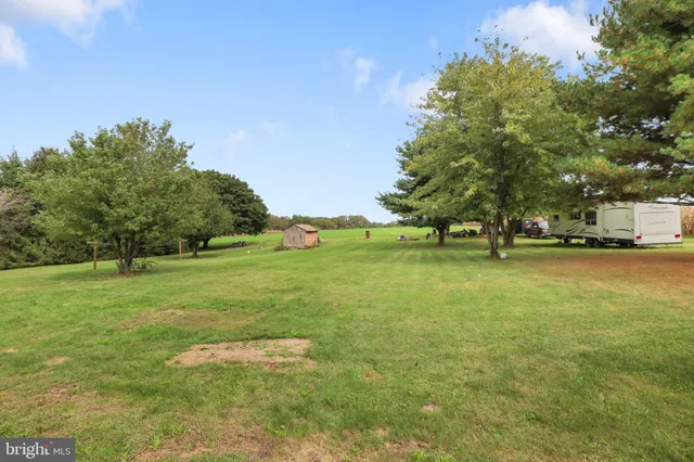 a view of outdoor space with deck and yard