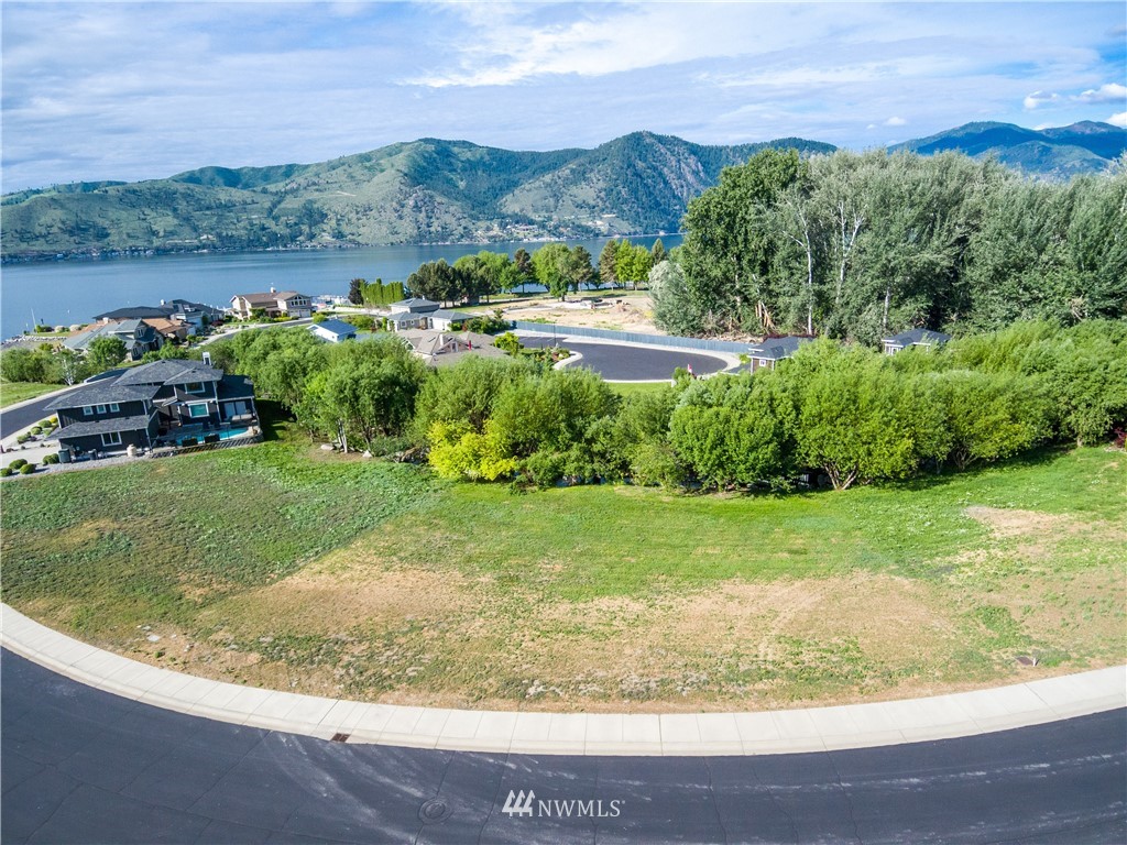 100 Wall Street Manson, WA 98831 - Photo 2 of 20 a view of a garden with a houses