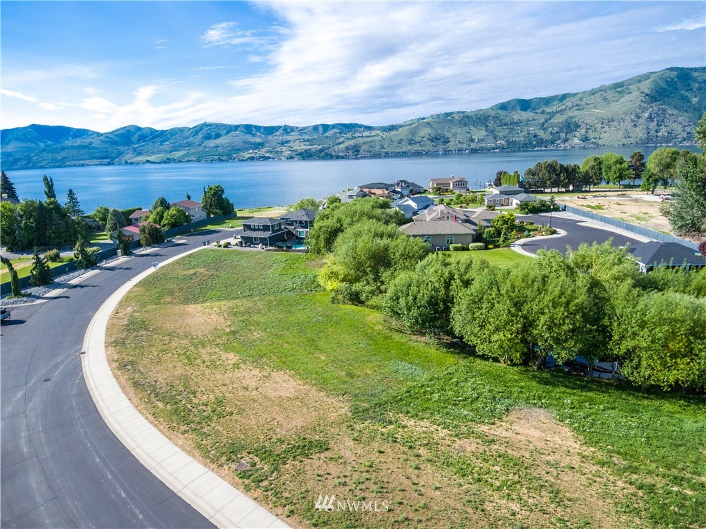 100 Wall Street Manson, WA 98831 - Photo 4 of 20 a view of a lake with a yard