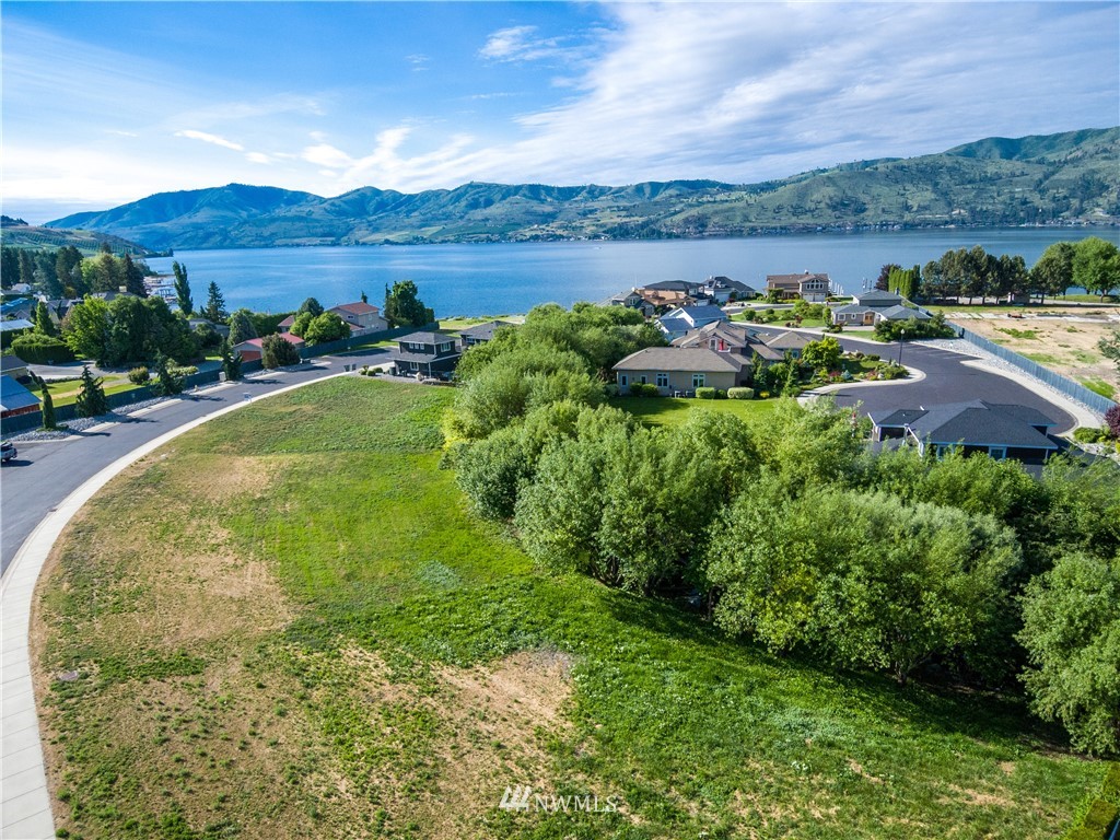 100 Wall Street Manson, WA 98831 - Photo 5 of 20 a view of a lake with a yard