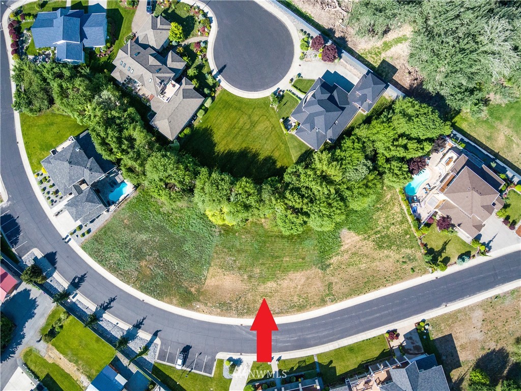 100 Wall Street Manson, WA 98831 - Photo 10 of 20 an aerial view of a house with a yard and tennis court