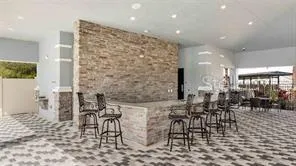 a living room with couches and a dining table with garden view