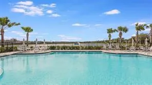 a view of a house with pool porch and sitting area