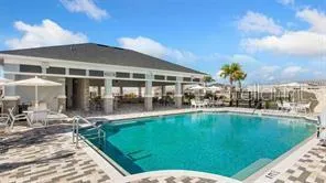 a view of sign board with flower plants