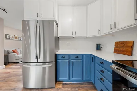 a kitchen with stainless steel appliances a refrigerator and cabinets