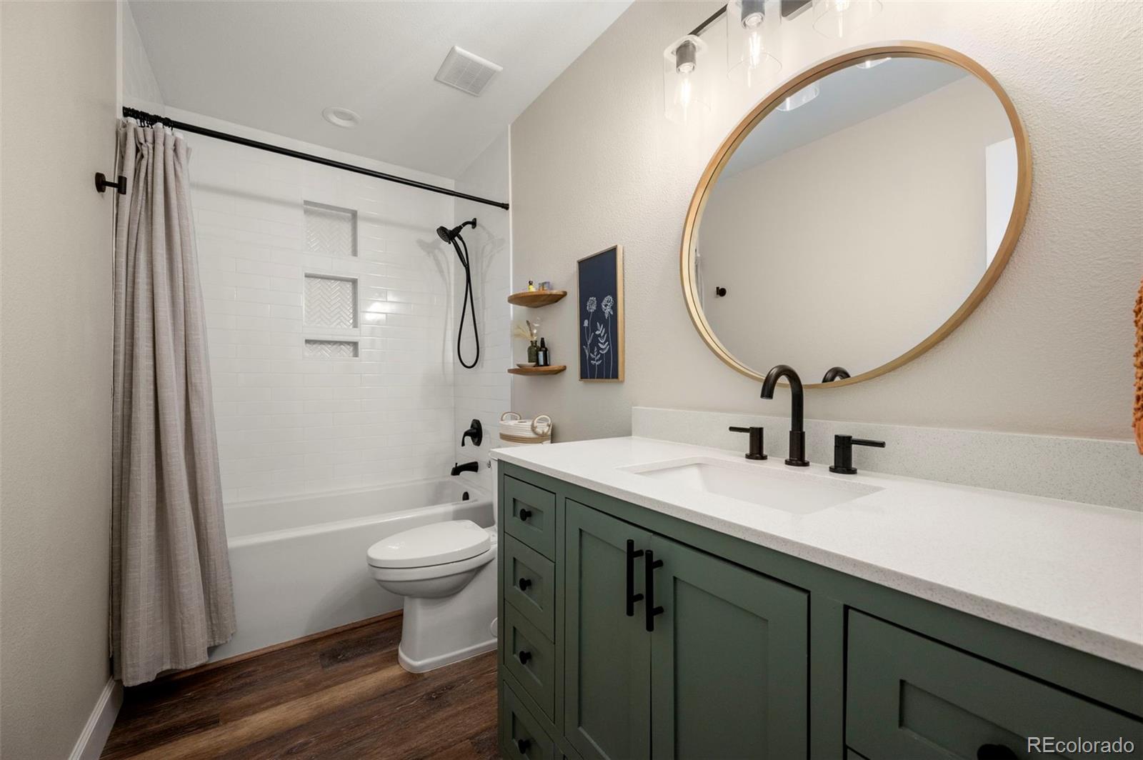 186 Quaker Street Golden, CO 80401 - Photo 22 of 50 a bathroom with a sink a toilet and a mirror