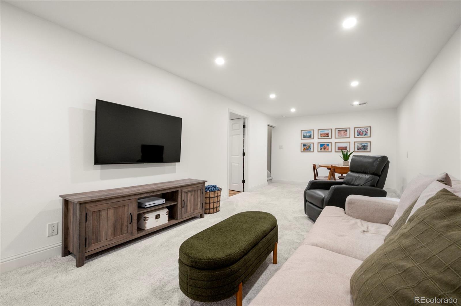 186 Quaker Street Golden, CO 80401 - Photo 29 of 50 a living room with furniture and a flat screen tv