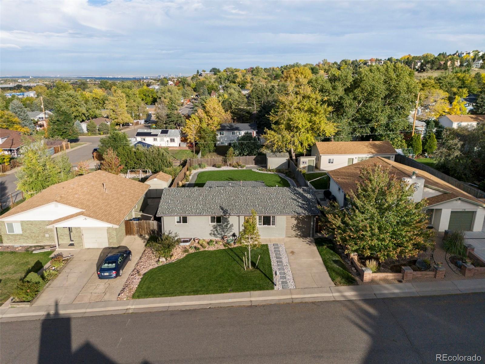 186 Quaker Street Golden, CO 80401 - Photo 3 of 50 an aerial view of a house with a yard and lake view