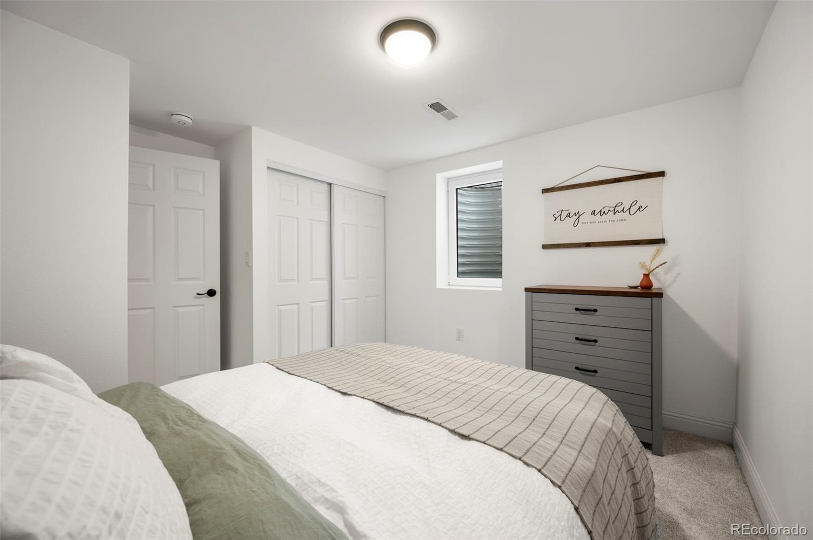186 Quaker Street Golden, CO 80401 - Photo 31 of 50 a bedroom with a bed and a window