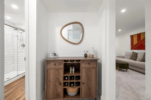 a view of living room with furniture and a potted plant