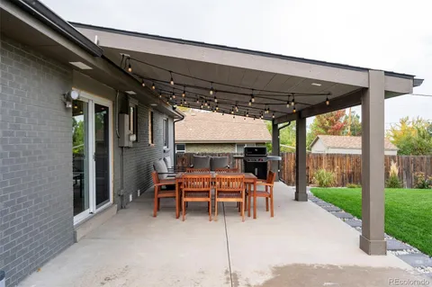 a view of a two chairs in the patio