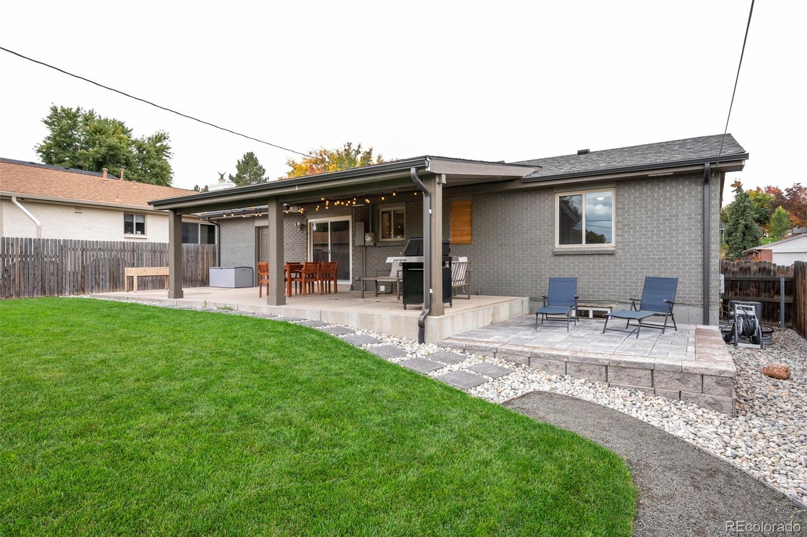 186 Quaker Street Golden, CO 80401 - Photo 43 of 50 a view of a house with a backyard and a patio