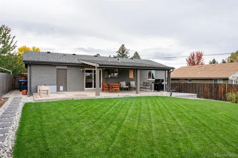 a view of a house with pool table and chairs