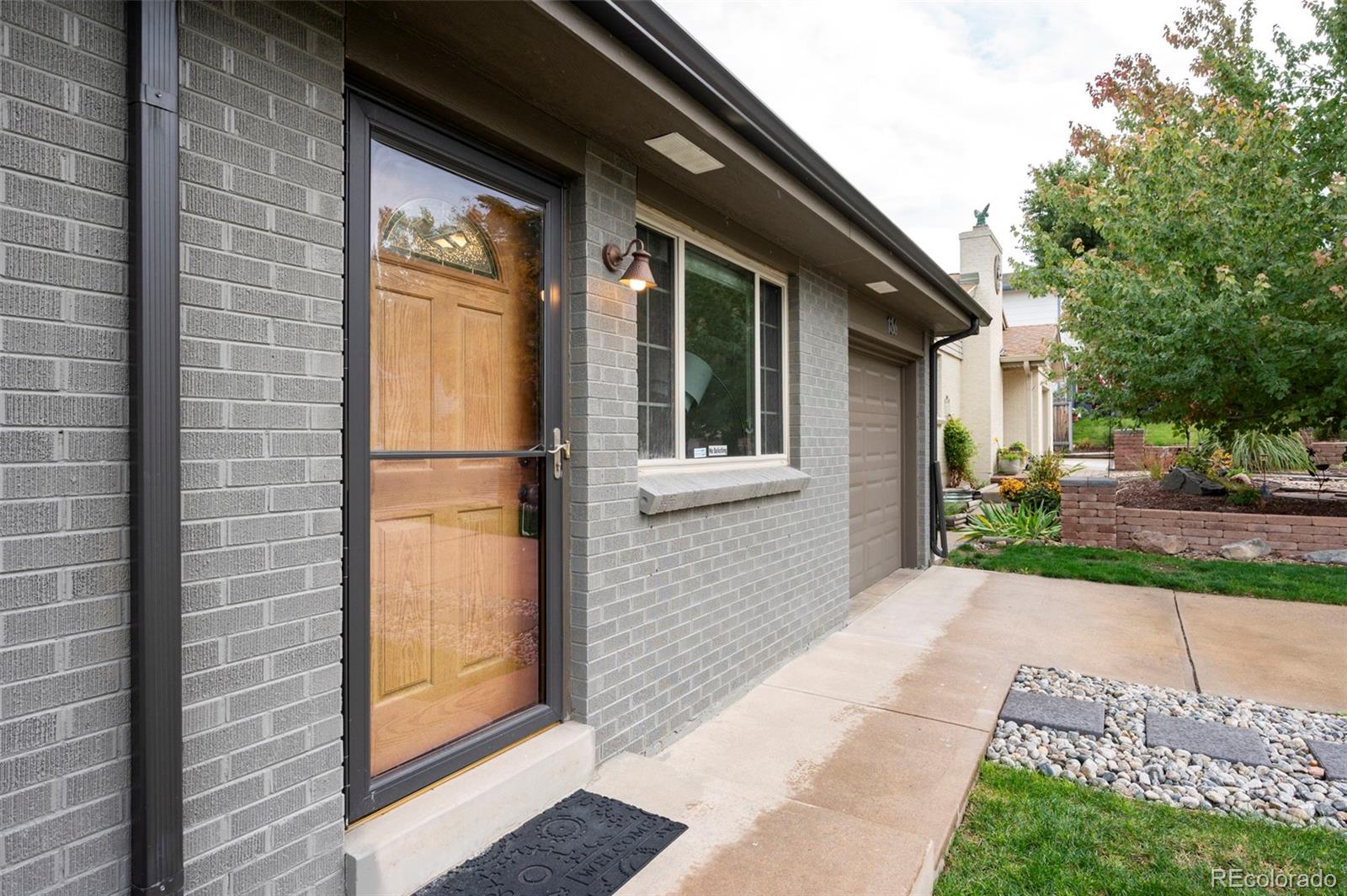 186 Quaker Street Golden, CO 80401 - Photo 5 of 50 a view of a brick house with a large windows