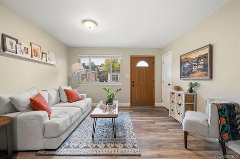a living room with furniture and a rug