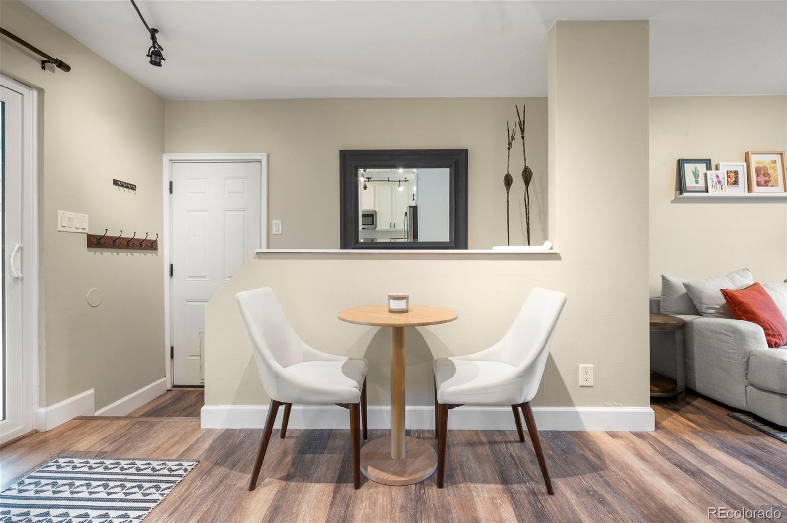186 Quaker Street Golden, CO 80401 - Photo 10 of 50 a view of a dining room with furniture and wooden floor